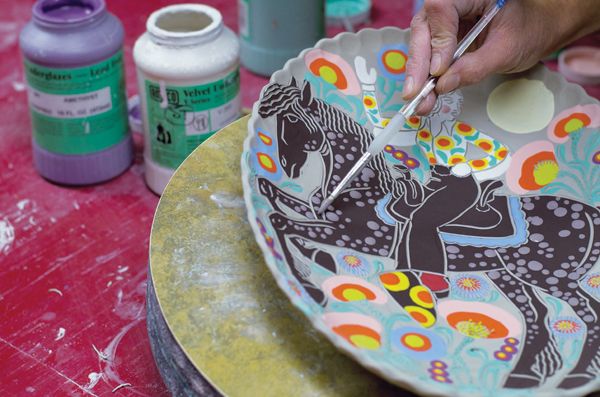 8 Finalizing the underglaze details on the horse prior to allowing the piece to dry and bisque firing it.