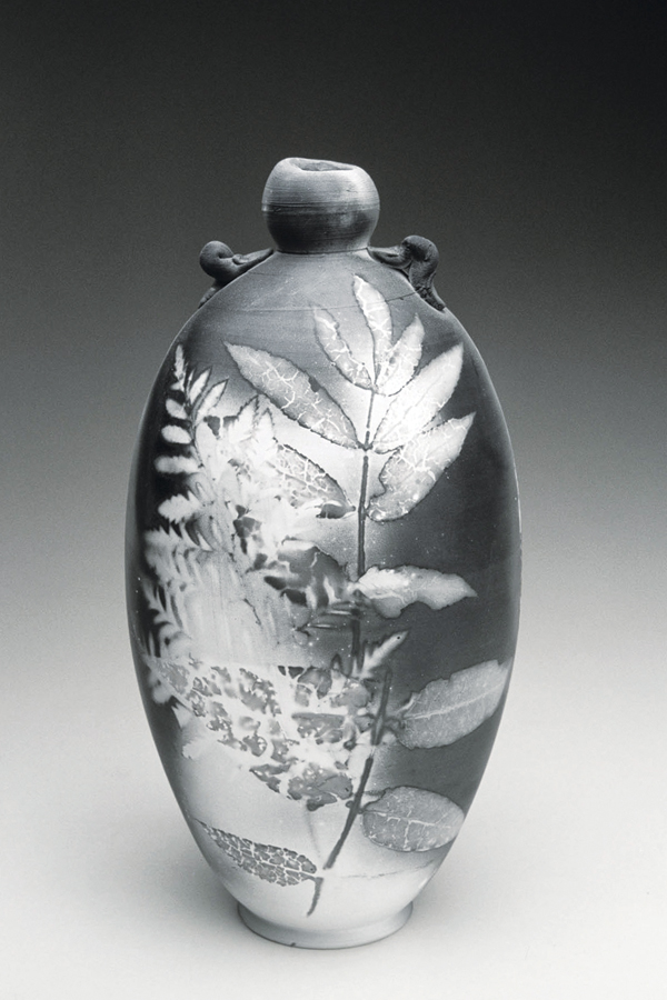 Dick Lehman’s saggar-fired bottle, 10 in. (25 cm) in height, Grolleg porcelain, fired to cone 06.