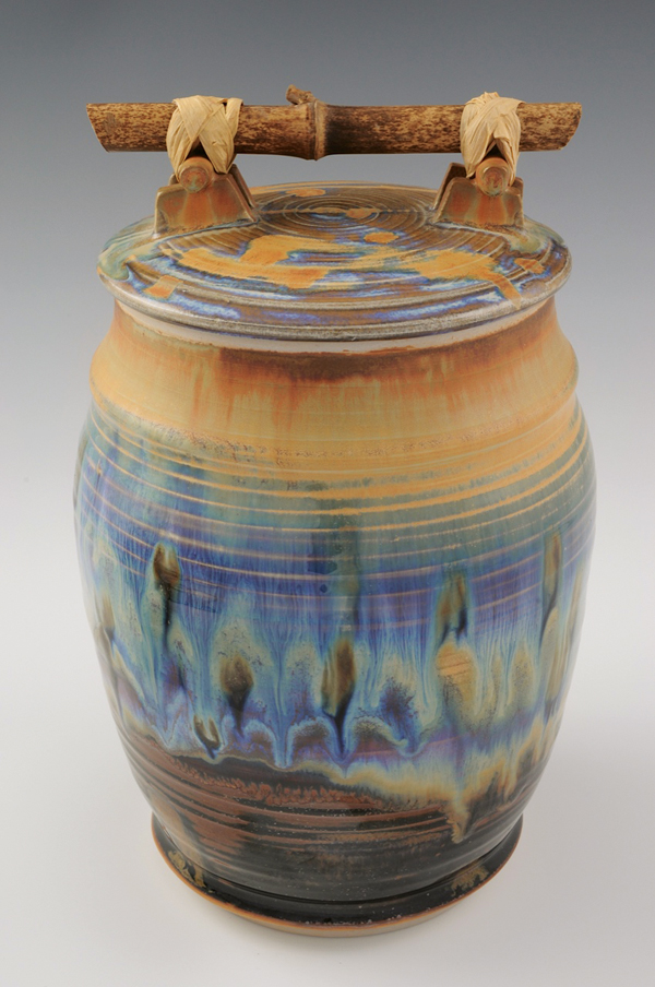 Covered jar, 10 in. (25 cm) in height, porcelain, homegrown black bamboo handle, fired in homemade gas reduction car kiln to cone 10, 2010.