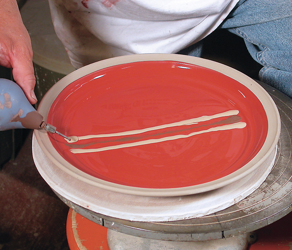 9 Slip trailing colored clays through a basic iron slip.