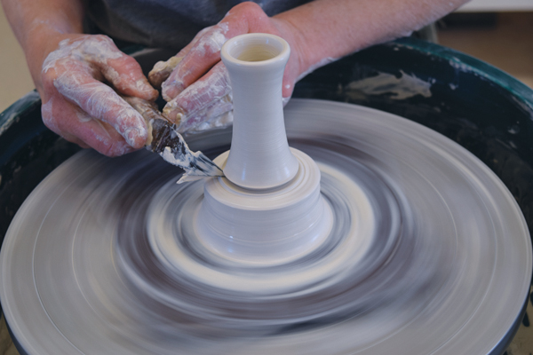 2 Center 1 pound of clay and throw a cylinder for the handle off the hump using half the clay.