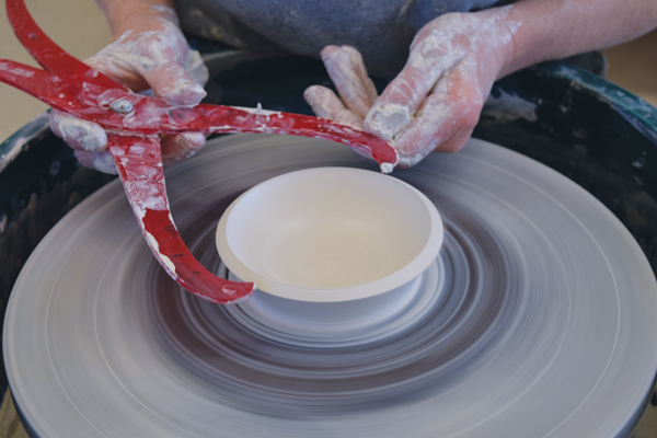 4 Use the remaining clay to throw a shallow bowl for a lid. Make the diameter match the measurements of the gallery.