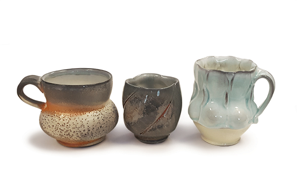 1 Pamela Theis’ wood-fired mug, 4 in. (10 cm) in diameter, porcelain, flashing slip, white liner glaze. 2 Kyle Johns’ cup 3¼ in. (8 cm) in height, porcelain, slip, soda-fired. 3 Brenda Lichman’s mug, 4½ in. (11 cm) in height, soda-fired porcelain, slip, and glaze. As I use these mugs, I find myself contemplating the atmospheric flashing as well as areas where the soda added flux to the glaze and accentuated raised textures—in short, the results of the collaboration between the kiln and the maker. 