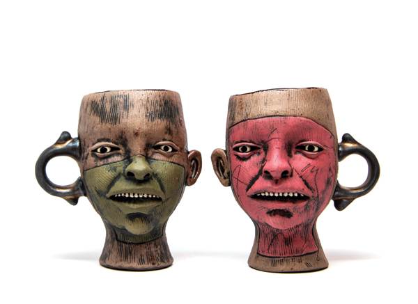 1 Ryan Myers’ cups, to 4½ in. (11 cm) in height, black stoneware, underglazes, stains, glazes. Photo: Silvia Palmer.