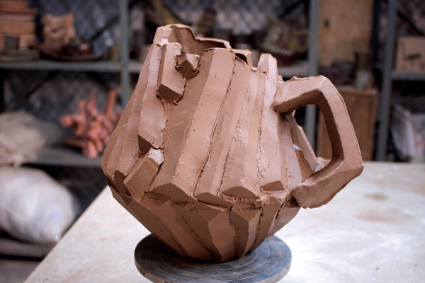 19 The nearly finished pitcher with the handle attached.