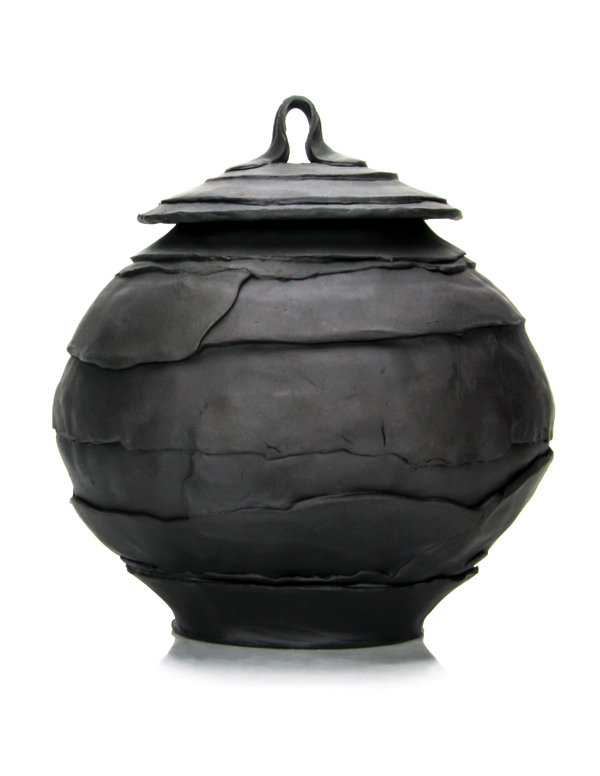 1 Black covered jar, 14 in. (36 cm) in height, slab-built and wheel-thrown colored porcelain, glaze, fired to cone 8 in oxidation, 2017.