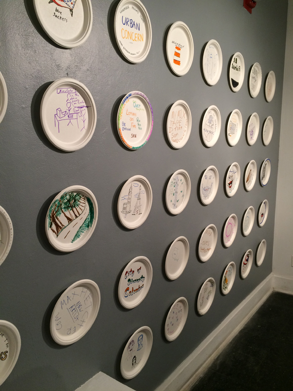 5 Detail of interactive element of the installation, with paper plates decorated by visitors to the gallery. 