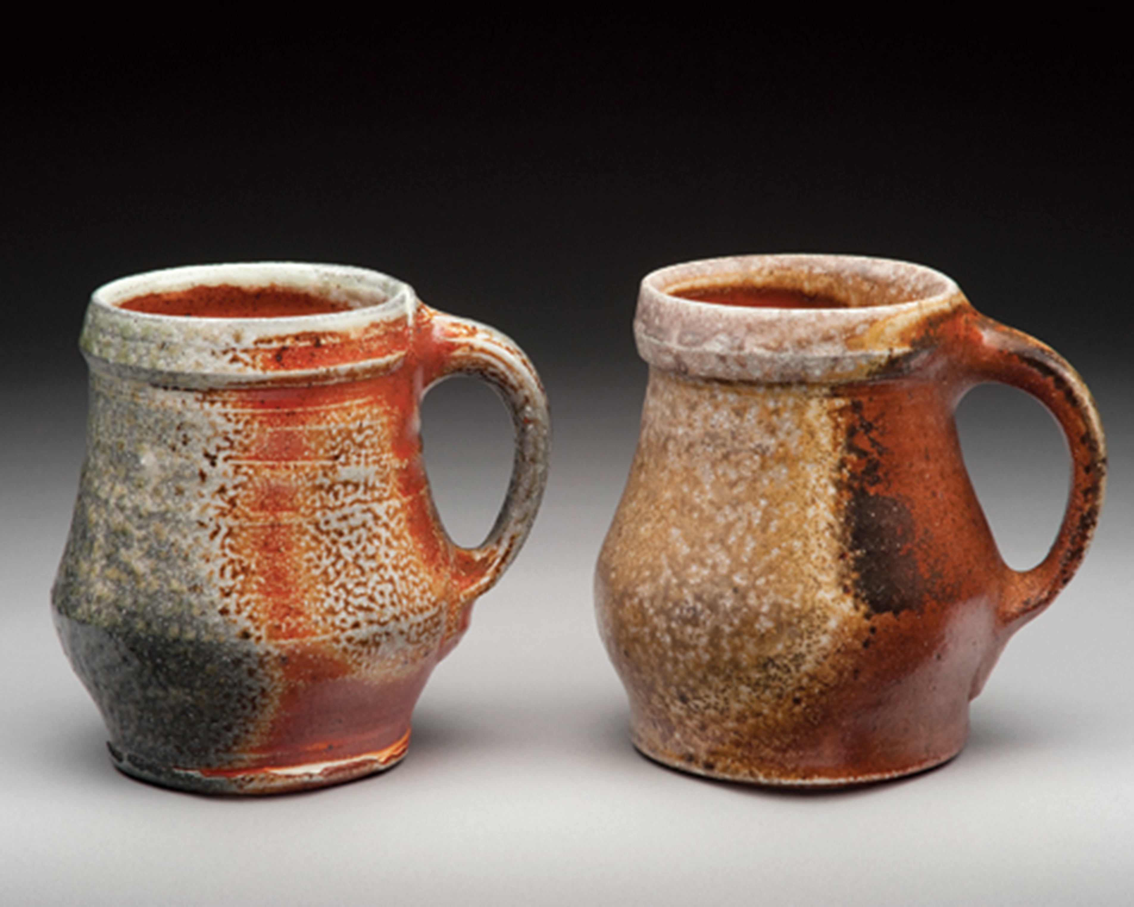 6 Mugs, 4½ in. (12 cm) in height, stoneware, slip, fired to cone 11 in an anagama kiln.