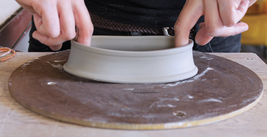 4 Elongate the lid and base forms into slight ovals, then tap them each gently on the table to make sure they’re flat.