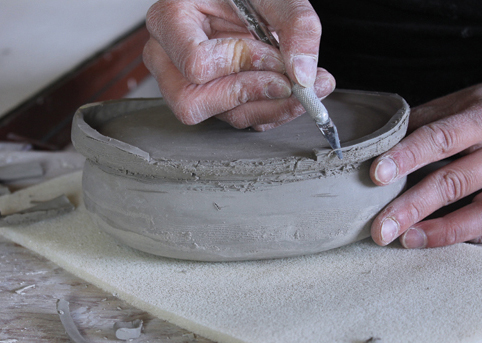 13 Use an X-Acto blade to trim the rim, then smooth the rim and shape it to fit.