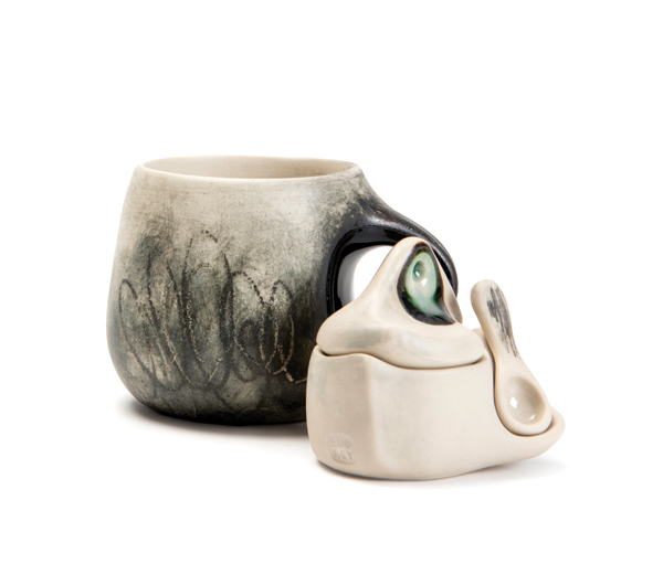  6 Audrey Rosulek’s cup and salt server, to 4½ in. (11 cm) in diameter, wheel-thrown and altered white stoneware, underglaze pencils, glazes. Photo: Silvia Palmer. 
