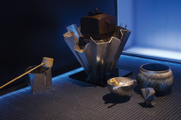 2 From left to right, Yasuko Hasegawa’s rinse-water container (kensui), wind furnace (furo), teabowl, and tea container (usuki) (in foreground), to 13 in. (33 cm) in height, clay, 2017. Junko Yamamoto’s fresh water pot (mizusashi) (far right), Illusion, 6 in. (15 cm) in height, clay. Photo: T. Yamashita.