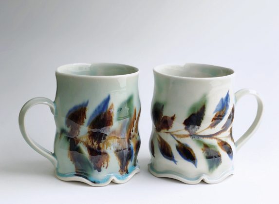 15 Ali Taj’s mugs, slab-built porcelain, gas fired in oxidation to cone 10, 2018.