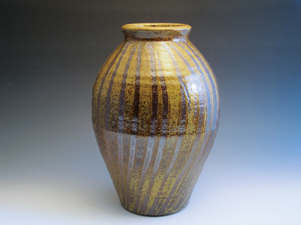 1 Jane Herold’s vase, 14 in. (36 cm) in height, stoneware, white slip, ash glaze, wood fired to cone 11.