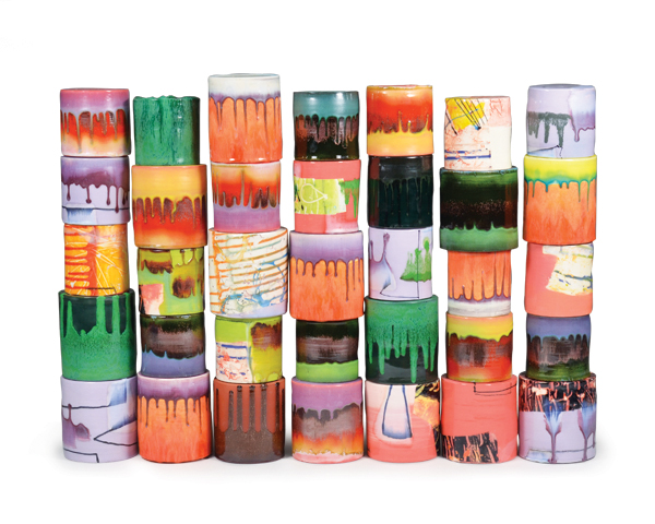 1 Lauren Mabry’s Composition of Enclosed Cylinders, 38 in. (97 cm) in length, red earthenware, slip, glaze, 2016.