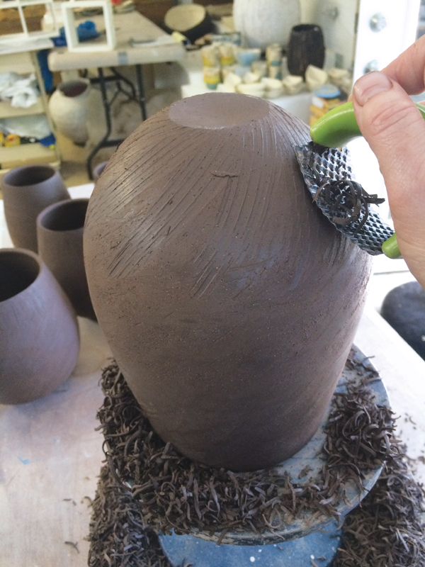 3 Carve and trim the base of the form with a Sur form rasp.
