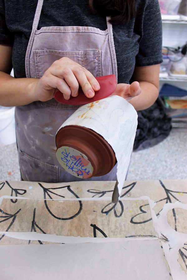 7 When the slip has dried to a satin-sheen, it’s ready to be applied to the clay form using a rubber rib as a squeegee.