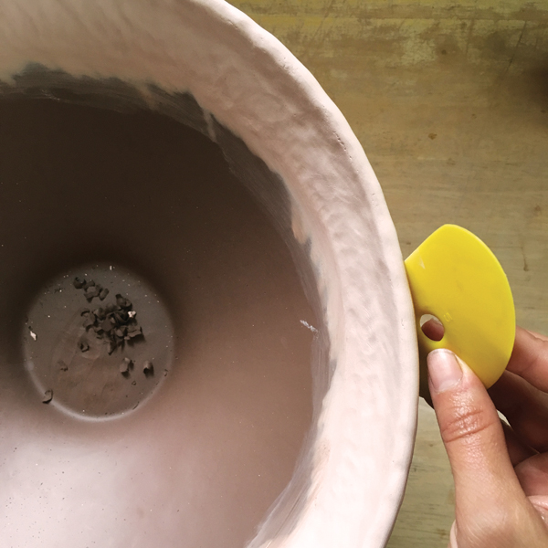 9 Smooth and shape the profile of the bowl with a rib on a slowly spinning banding wheel.