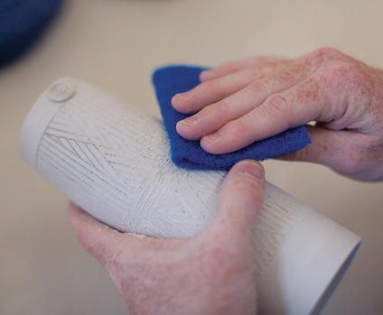 12 Use a kitchen scouring pad to remove rough edges on the bone-dry clay.