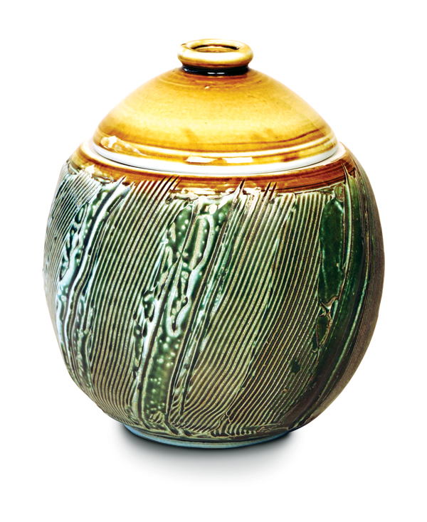 1 Bob Swaffar’s lidded jar, 9 in. (23 cm) in height, wheel-thrown porcelain, applied slip texture, glazes, soda fired to cone 10, 2017.