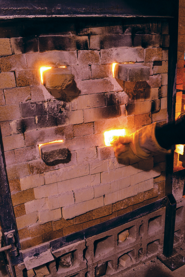 13 Push the burritos into the firebox of the soda kiln at cone 9 using a metal rod, or other fire-safe tool. Amount added will depend on how much residual soda is already in the kiln.