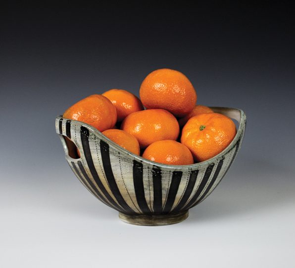 Striped swoop bowl, thrown and altered porcelain, painted and inlaid underglaze decoration, soda fired to cone 10.