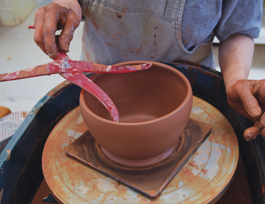 4 Throw the outer pot as a rounder bowl to make room for water. Check that the rim diameter matches the caliper measurement.