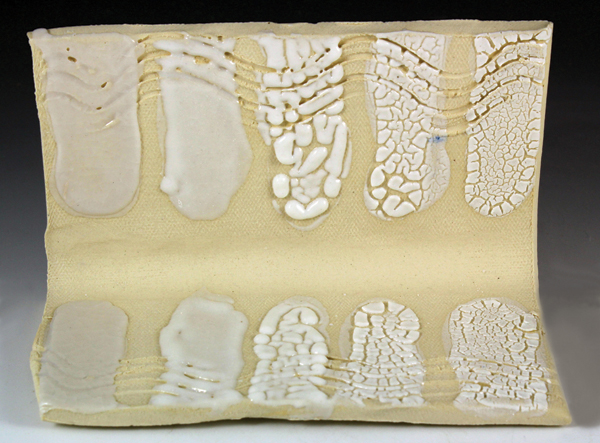 2 Beading glaze test tile showing incremental 10% additions of magnesium carbonate from left to right.