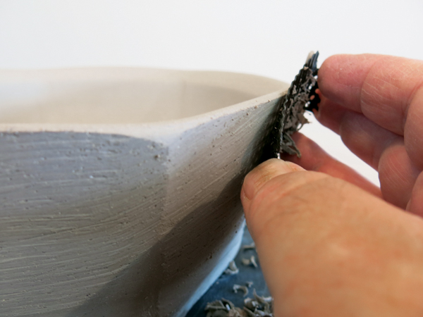 7 Use a Surform rasp to define the facets to about ¾ down the bowl wall.