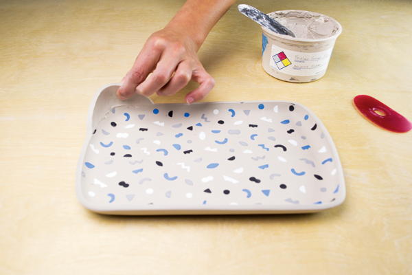 9 Flip the cookie tray over, remove the mold, and attach the handle to the tray.