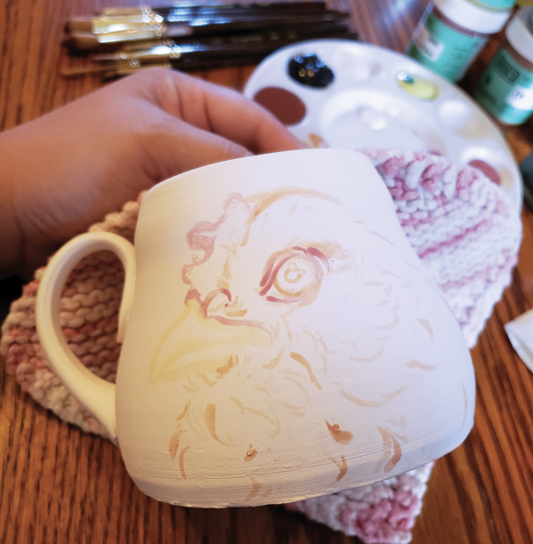 1 Using a watered down underglaze, apply an underpainting.