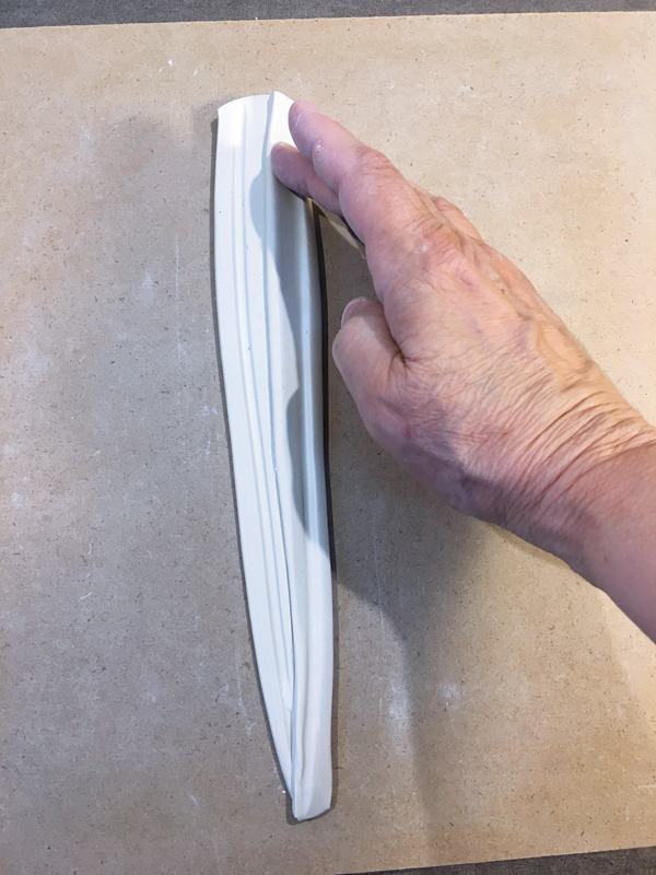 2C Re-attaching the cut length with pressure at 30—45°.