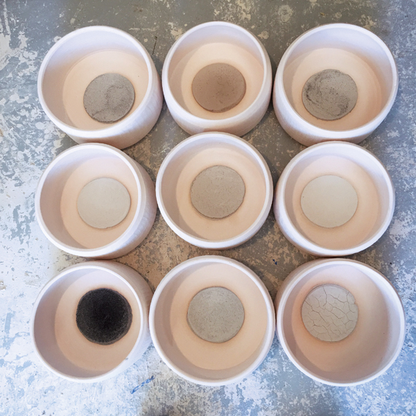 5 Making ash patties; ash samples are mixed with 50 ml of diluted glaze and formed into patties inside of each vessel. Glaze is then applied to the inside and outside of the vessels. 