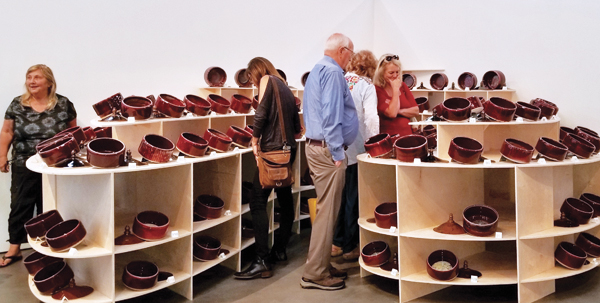 7 Sonoma Ash Project (installation views), 12 ft. (3.6 m) in width, 112 porcelain vessels with lids, (wood display by 180 Studios, Santa Rosa, CA), 2018. Courtesy of the Museum of Sonoma County. Photo: Steve Atilano.