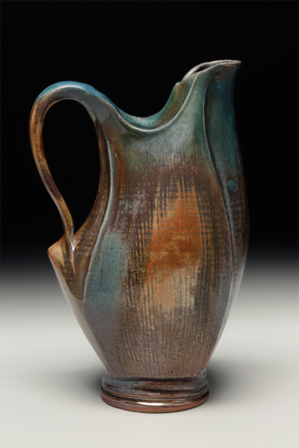 3 Sarah Wells Rolland’s closed-form pitcher, 16 in. (41 cm) in height, wheel thrown, altered, darted, sculpted, glazes poured and sprayed, fired to cone 10 in reduction. Photo: Tim Barnwell.