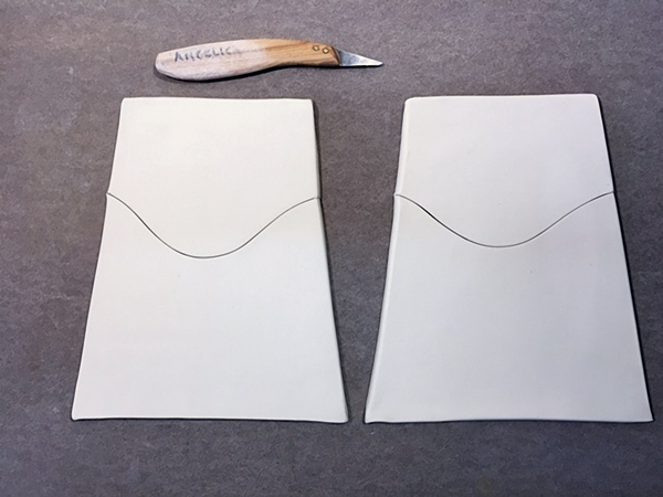 2 Mark starting and ending points of curved cuts on the side pieces, then cut the shallow curves.
