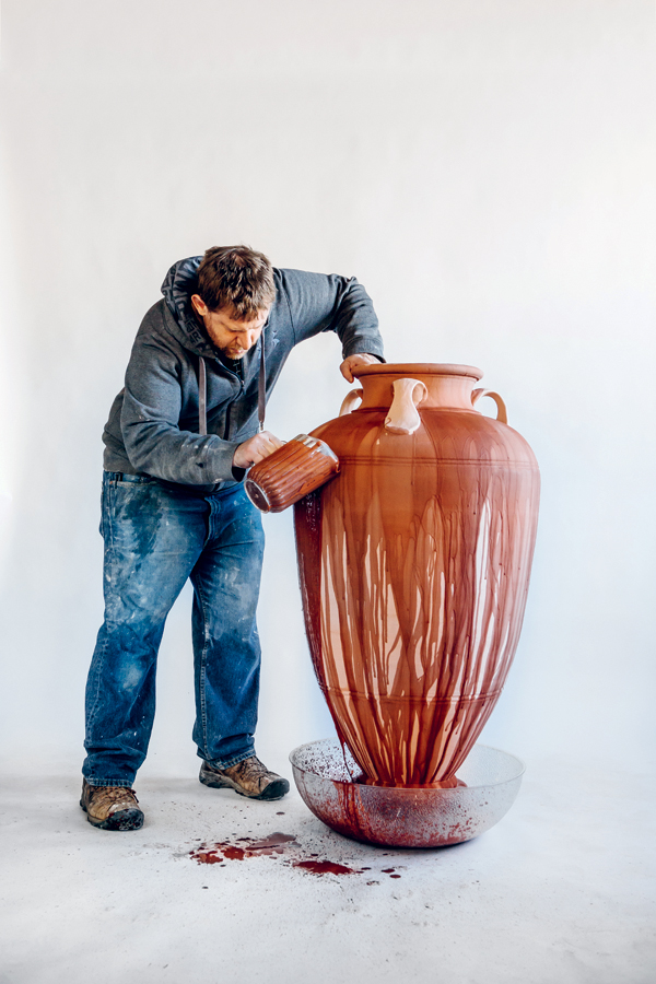 3 Continuing to display pouring glaze over large work.