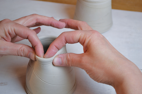 5 Form and pinch out a spout on the creamer’s rim.