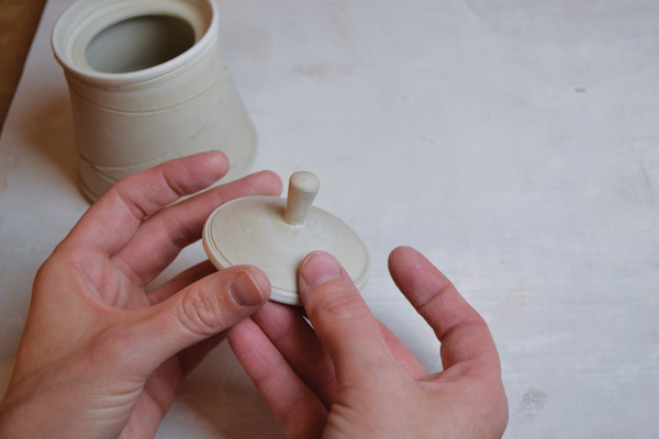 6 Roll and attach a stem-like knob to the trimmed sugar-bowl lid.