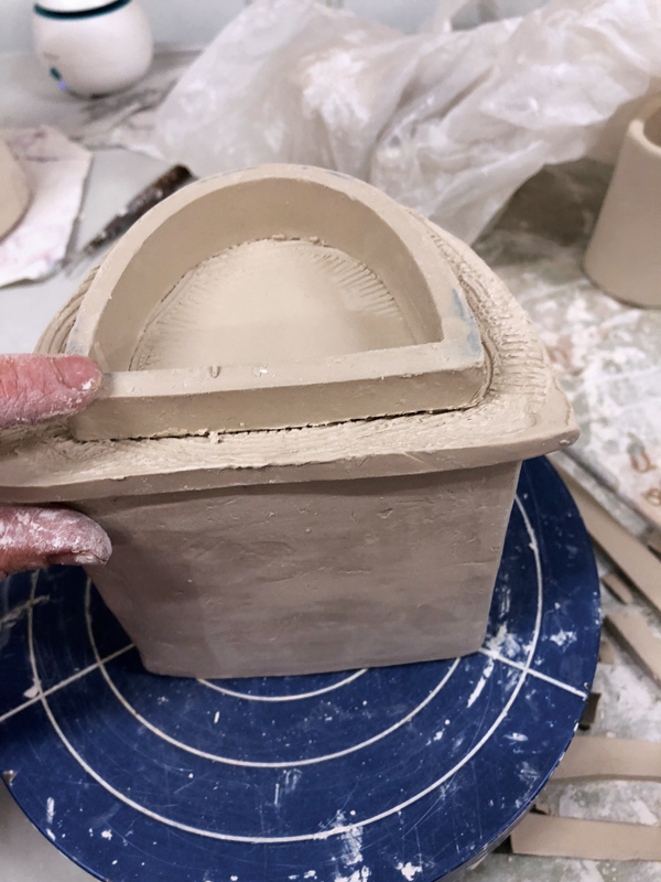 9 Score and attach the flange to the lid, centering placement within the impression.