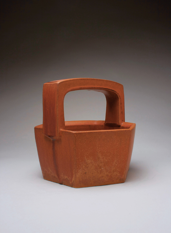 Basket, wheel-thrown, altered, and carved stoneware, handbuilt handle, Orange Crush glaze, fired to cone 9 in oxidation, 2018.