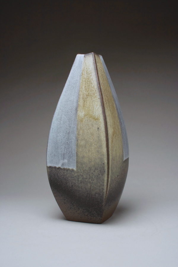 Bottle, wheel-thrown, altered, and carved stoneware, layered slips and glaze, fired to cone 9 in oxidation, 2018.