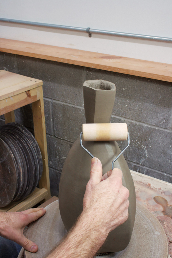 7 Use a pony roller to refine the neck and sharpen the edges.