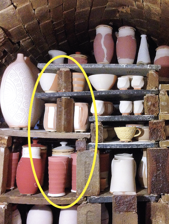 1 Before: Unconventional stacking with inadequate kiln furniture (see offset kiln posts, circled) may prove to be disastrous.