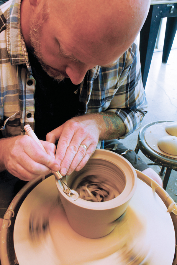 3 When the clay is leather hard, trim another gallery into the bottom of the form. 