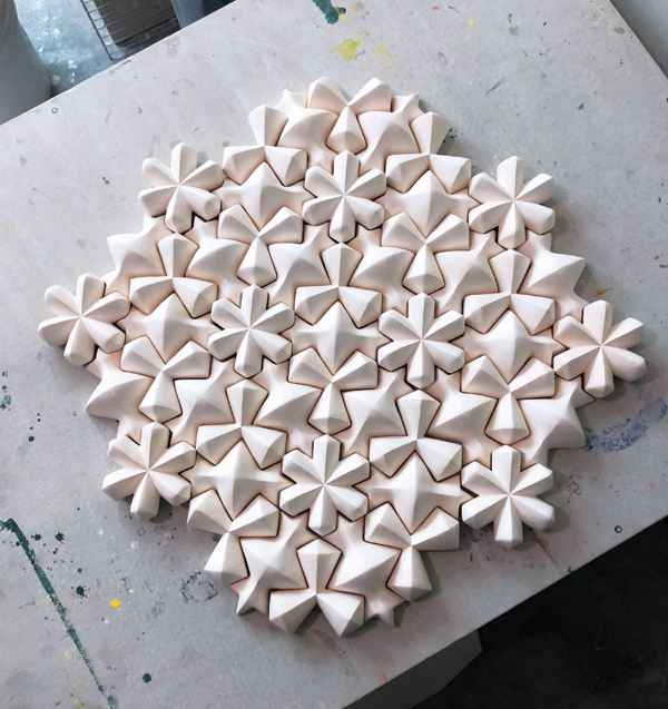 13 Use bisque-fired tile forms to develop desired layout of the final piece.