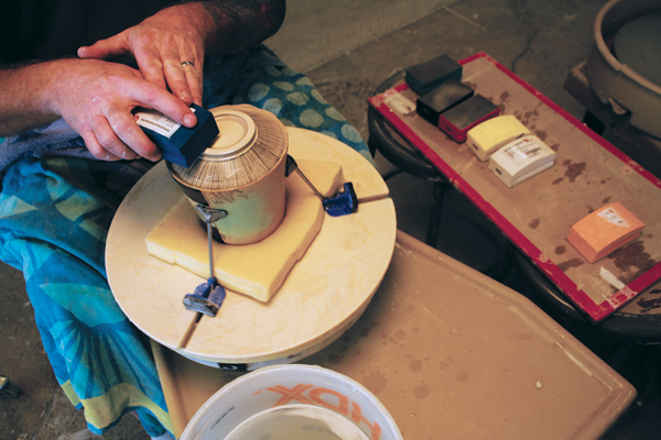 15 After the jar has undergone the 7–8 separate firings, it’s time to wet sand the foot with concrete polishing pads, ranging from 50 grit to 3000 grit.