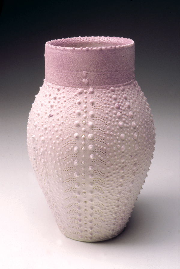 8 Gwen Heffner’s Urchin Vase, wheel-thrown, incised, slip trailed, violet slip sprayed over top of a matte white glaze.