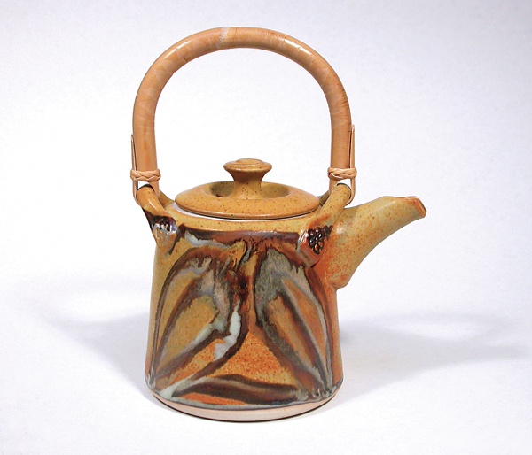 14 Fired completed teapot with dipped, poured, brushed, and trailed glaze decoration.