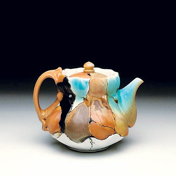 9 Brenda Lichman and Paul Ide’s teapot, 5½ in. (14 cm) in height, wheel-thrown and altered porcelain, underglaze, fired to cone 10 in oxidation, 2018. Photo: Paul Ide.